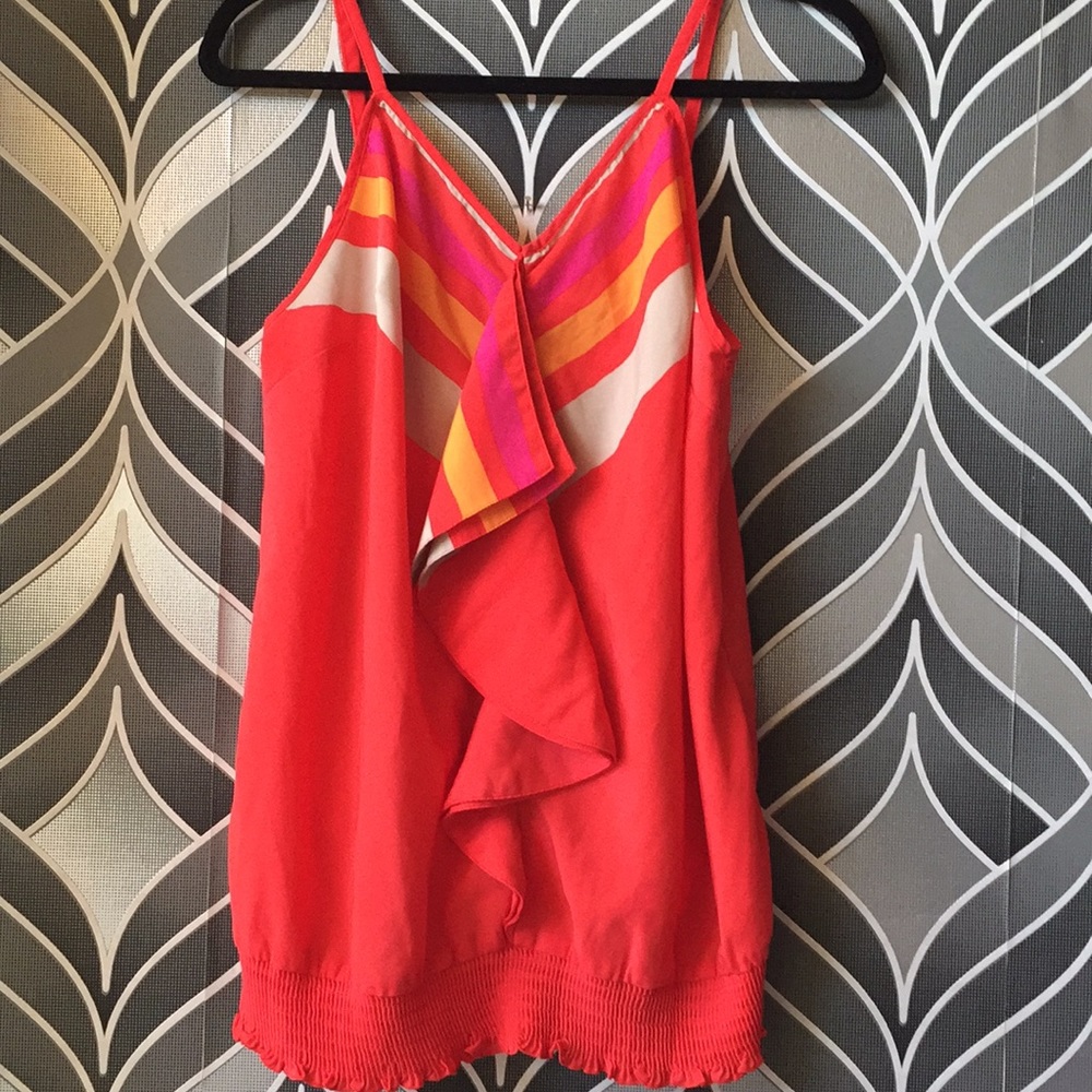 Dark coral ruffled top with stripe details.